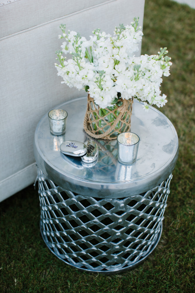 Jennifer and Jimmy Goff wedding side table with flowers and candles