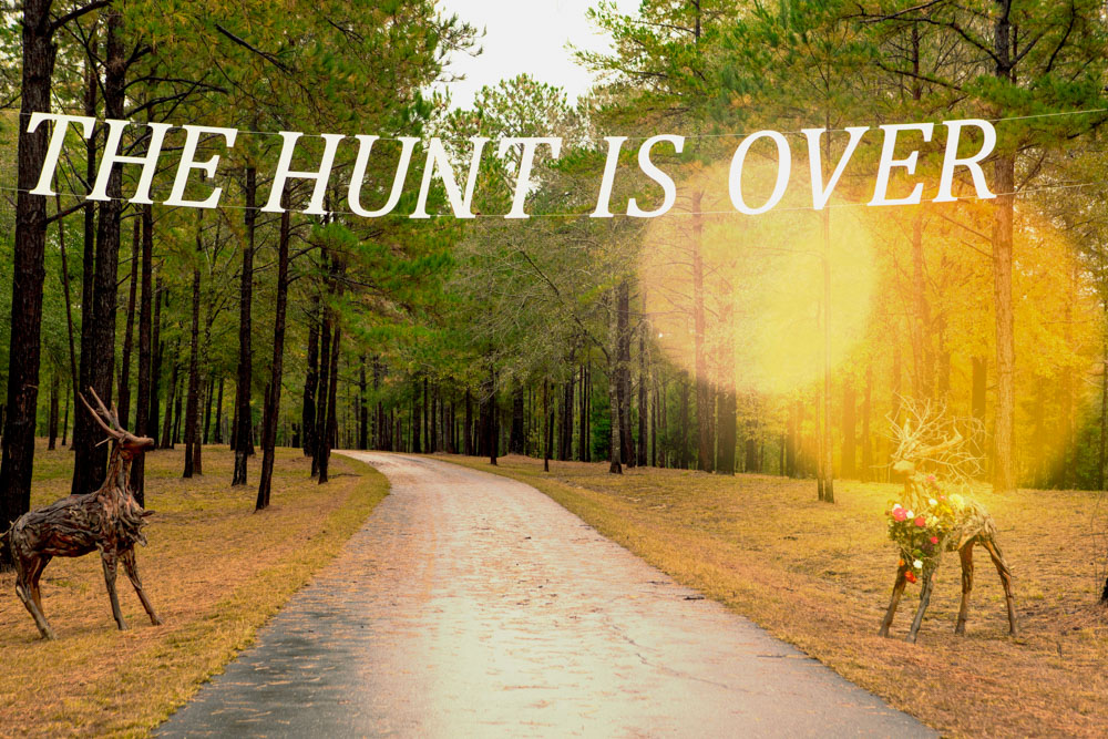 The hunt is over sign with deer