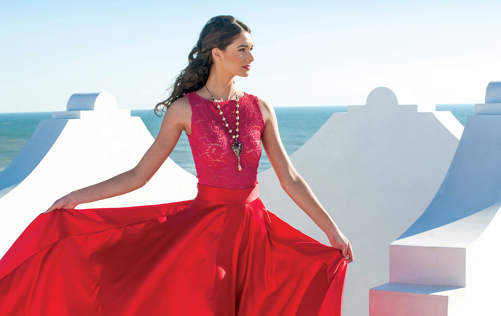 Model in flowing red dress