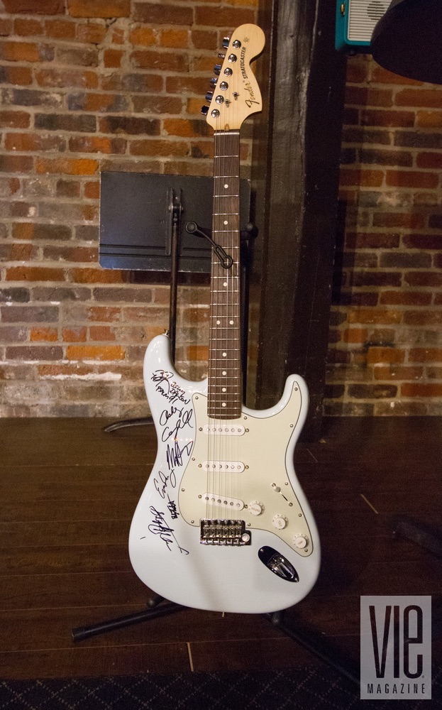 Live auction item, a sonic blue Fender American Special Stratocaster, signed by all our performers at VIE Magazine's 