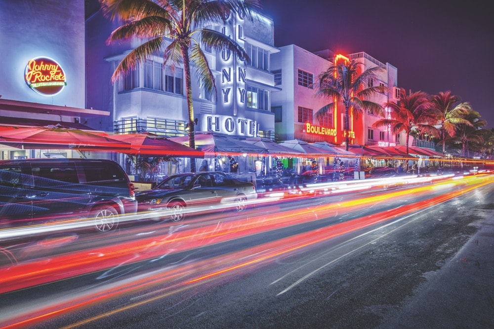 At night, the neon signs and bright lights along Ocean Drive make for an exciting view. Photo by ESB Professional / Shutterstock