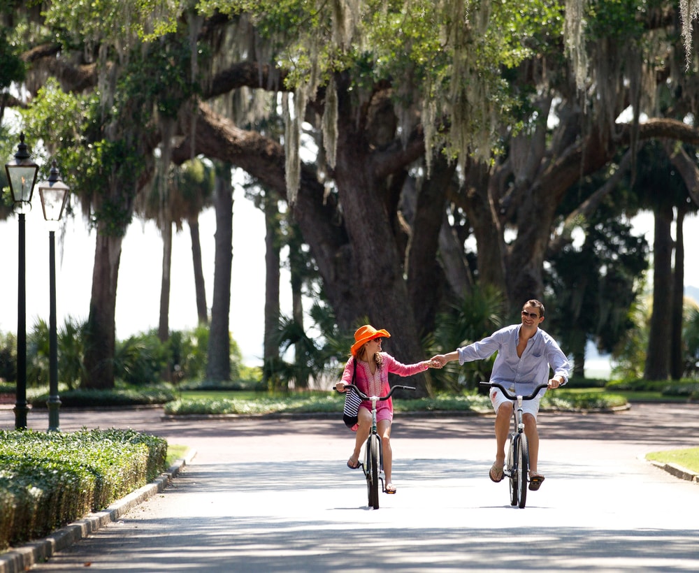 Couple riding bikes at Montage Palmetto Bluff South Carolina
