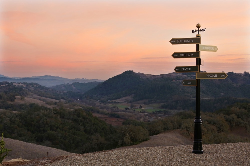 Jordan Vineyard and Winery; View of the hills in Sonoma County, California with a directional sign pointing to various popular locations