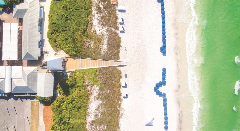 This aerial view of the beach access at the Coleman Pavilion obelisk illustrates the wedge shape of the stairs as they descend to the white sand, creating an illusion the sides of the ramp are parallel. Michelangelo used this technique at Capitoline Hill in Rome. Photo by Fletcher Isacks