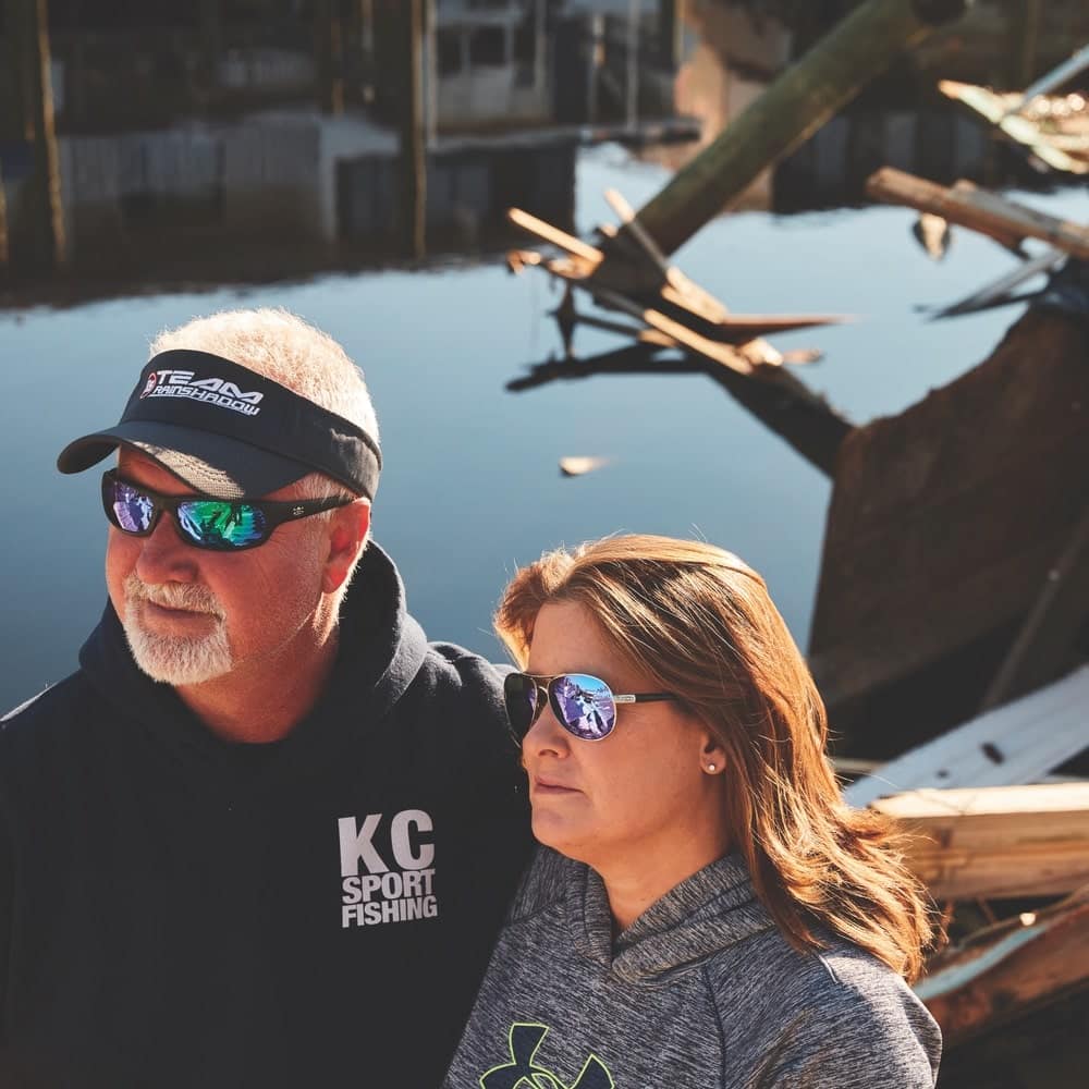 Owners Kevin and Cyndi Lanier of KCSportfishing lie amid the wreckage in Mexico Beach, Florida, as part of the Never Forgotten Coast campaign. In the wake of Hurricane Michael, the Laniers plan to rebuild their lives and their business alongside their neighbors.