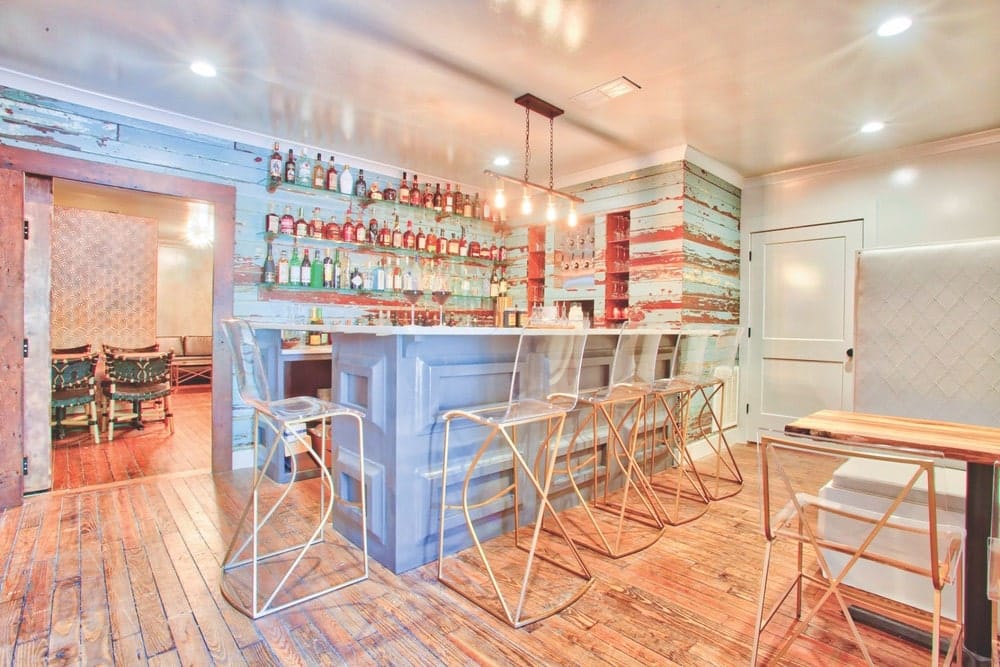 Enjoy a refreshing cocktail at The Wilbur Bar, located on the first level of The Roost boutique hotel in Ocean Springs, Mississippi. | Photo courtesy of The Roost