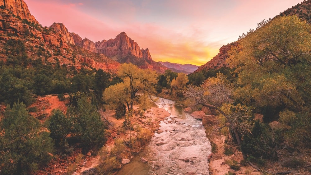 A beautiful sunset over the red cliffs and Virgin River in Zion National Park, Utah