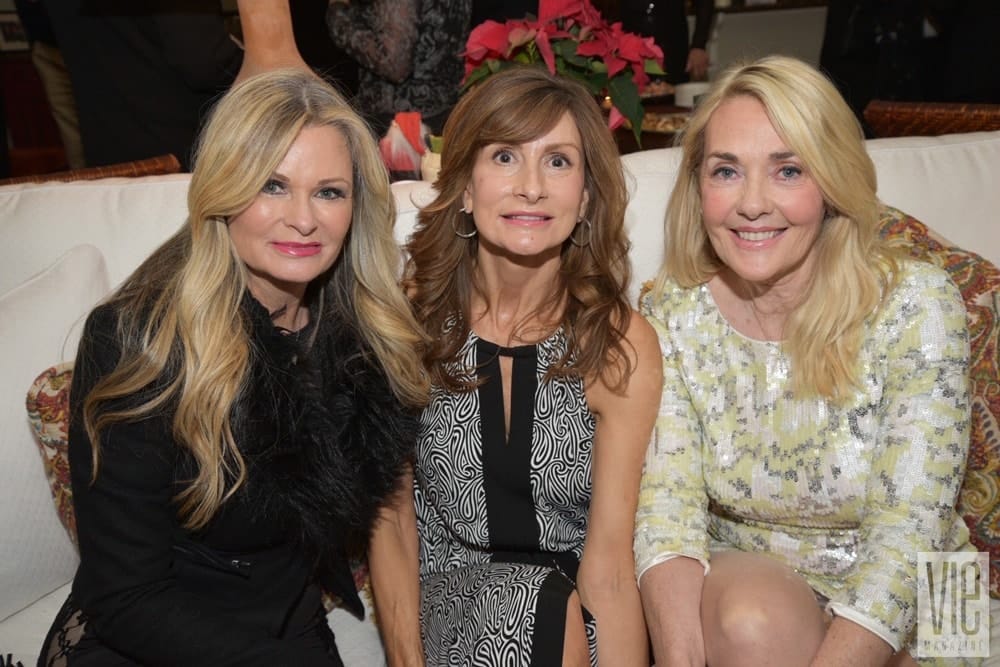 Lori Sweeney, Claire Nuckles, and Lisa Burwell attend Cafe Thirty-A's Christmas Charity Ball benefitting Caring and Sharing of South Walton, in Seagrove Beach, Florida on December 10, 2016