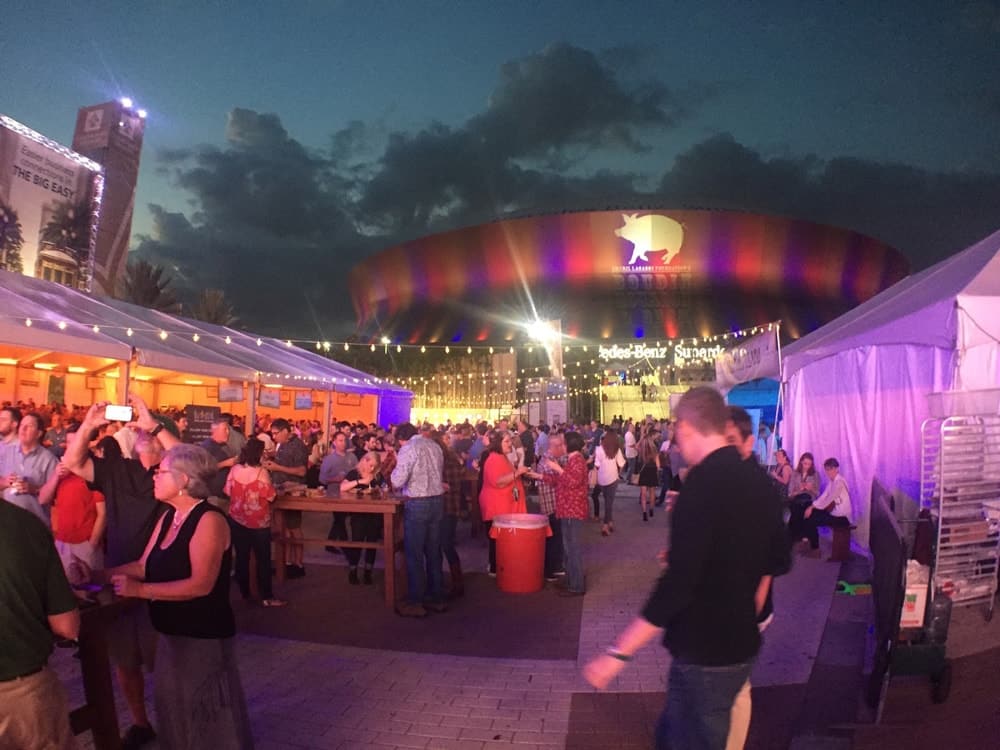 Stage, guests, and tents set up for Boudin Bourbon & Beer 2016 charity event in New Orleans, Louisiana