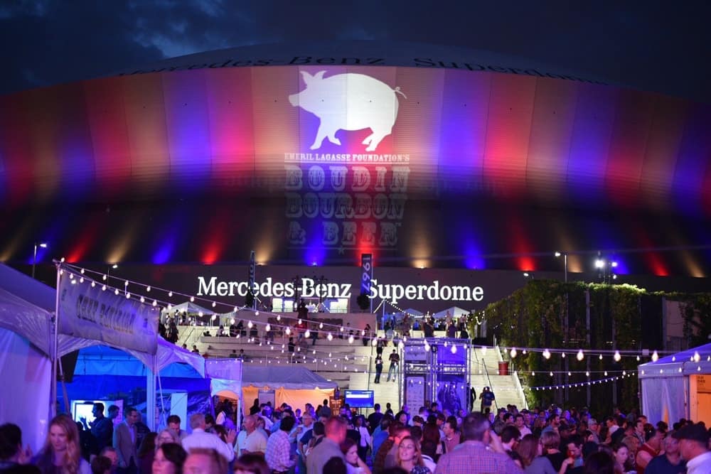 Mercedes-Benz Superdome, guests, and tents set up for Boudin Bourbon & Beer 2016 charity event in New Orleans, Louisiana
