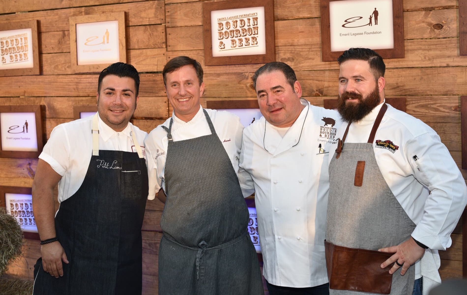 Three male chefs pose with Emeril Lagasse at the Boudin Bourbon & Beer 2016 charity event in New Orleans, Louisiana