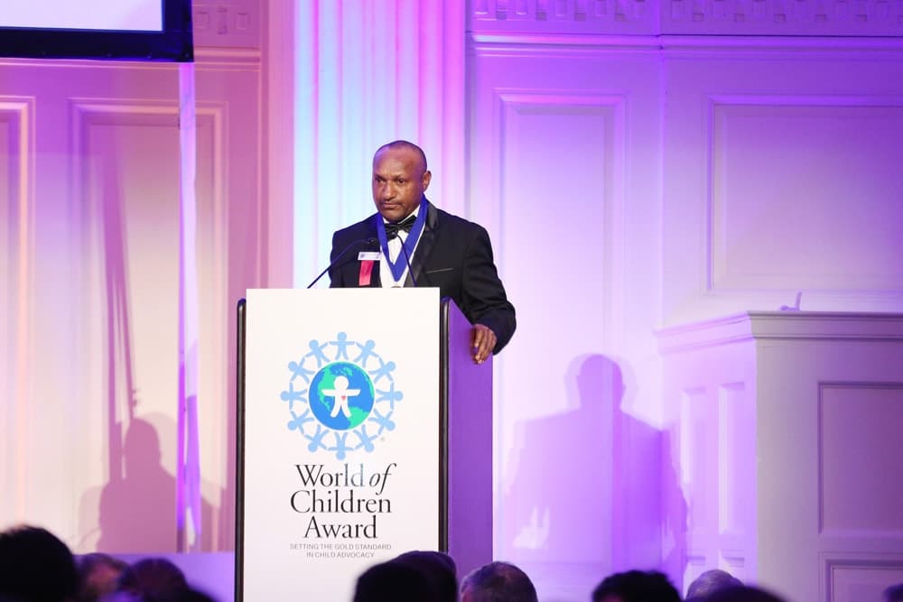 Honoree Jimmy Drekore speaks on stage during the World of Children Awards Ceremony