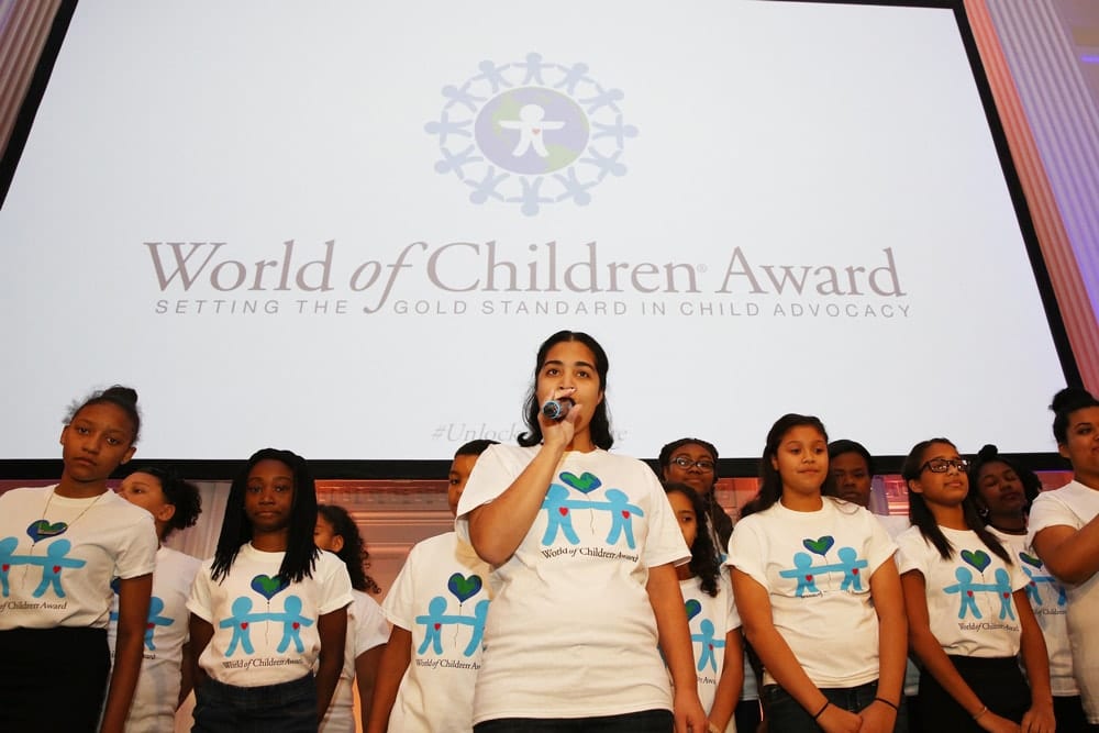 The Children's Aid Society Chorus performs on stage during the World of Children Awards Ceremony