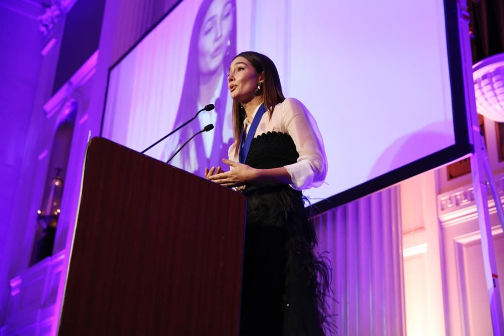 Model Lily Aldridge Followill speaks on stage during the World of Children Awards Ceremony