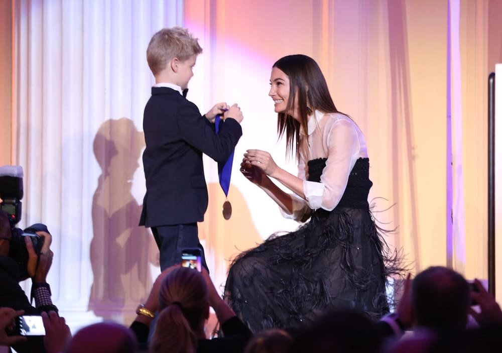 Model Lily Aldridge Followill accepts an award on stage during the World of Children Awards Ceremony