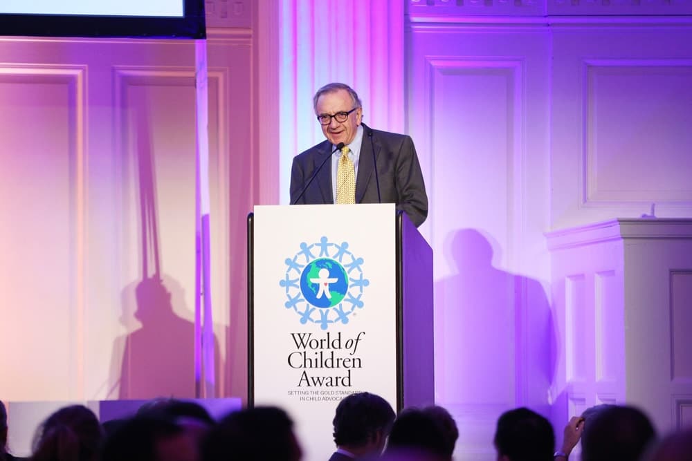 World of Children Award Co-Founder & 2016 Alumni Honors Co-Chair Harry Leibowitz speaks on stage during the World of Children Awards Ceremony