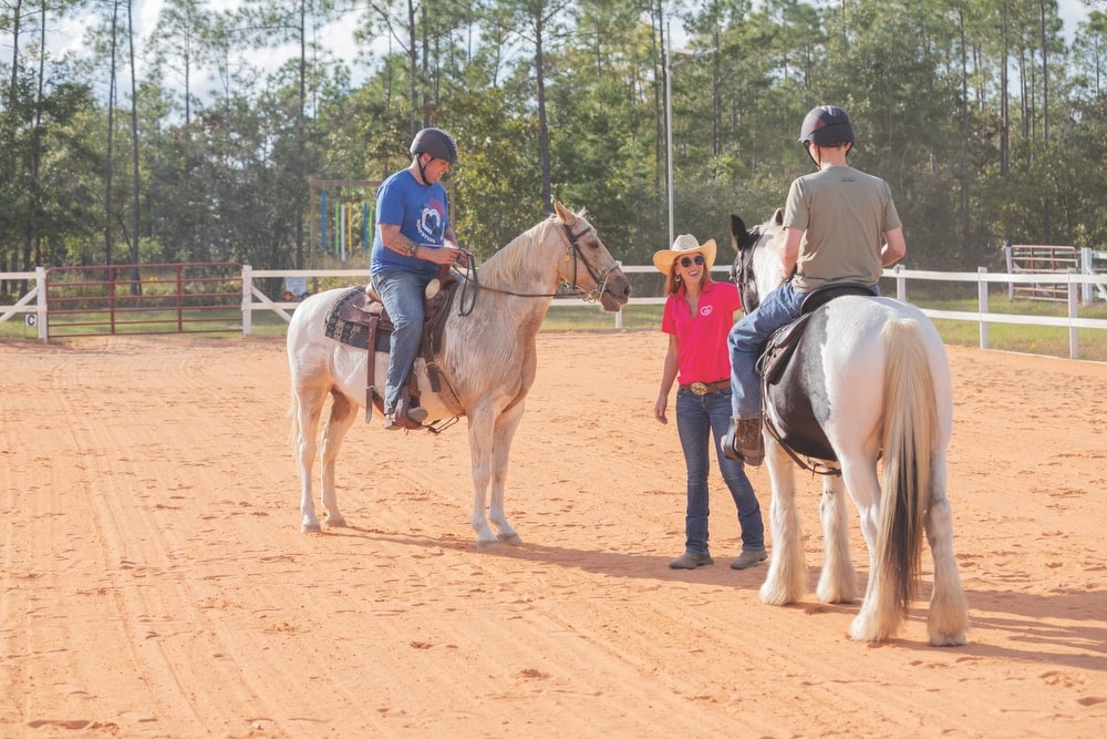 Horseback riders getting lessons