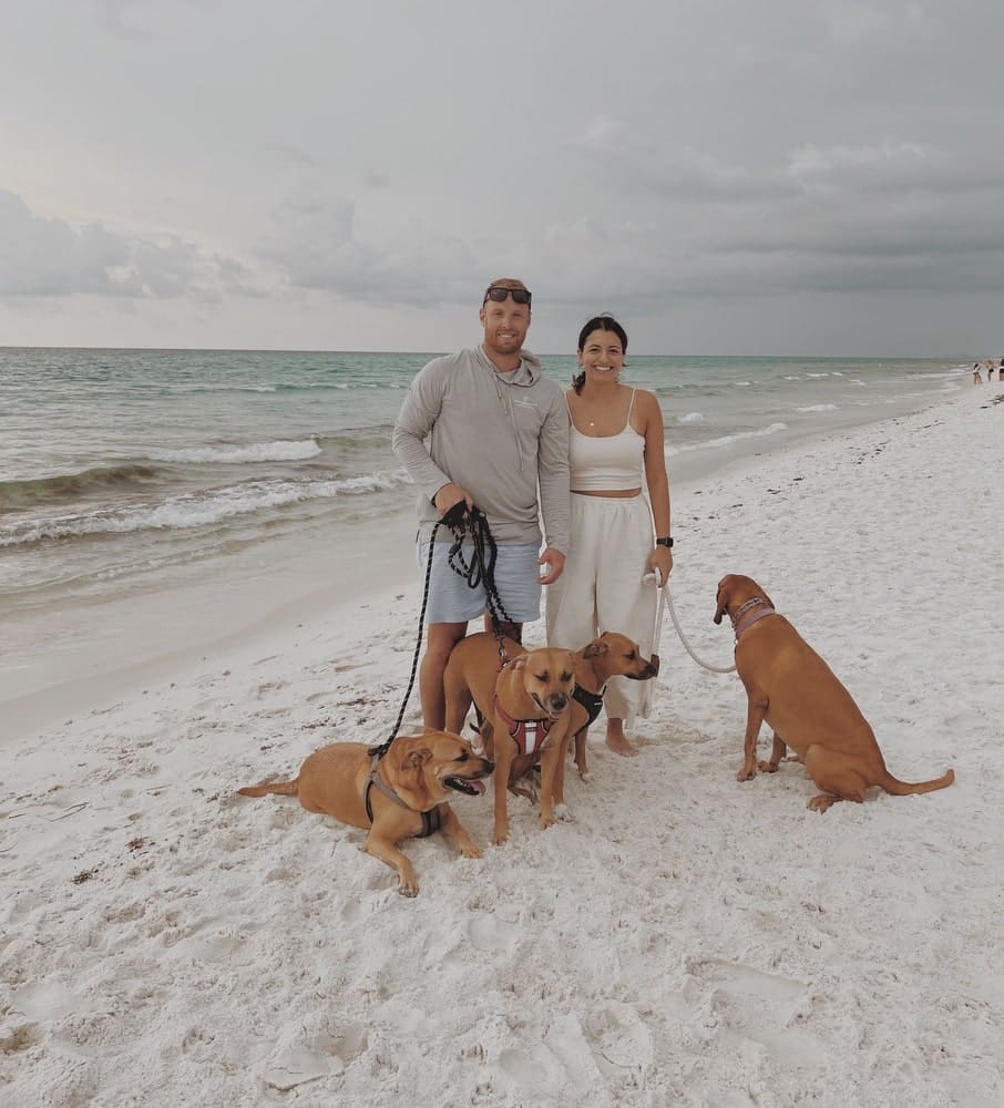 Brad Reese with his girlfriend, Jennifer, and dogs Paxton, Eve, Zoë, and Josie, enjoying the sunset on 30-A’s beautiful white-sand beaches