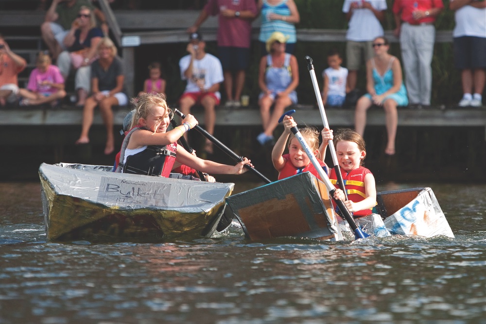 Participants in the annual cardboard boat race give their all—some more successfully than others.