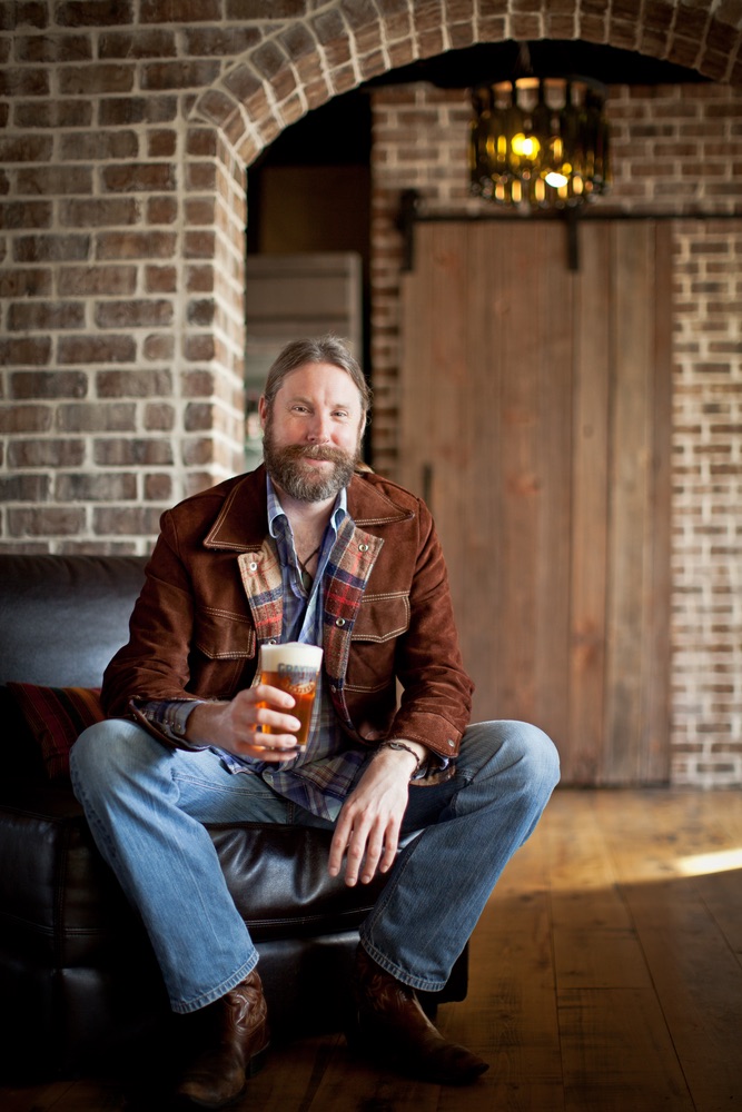 Shank (the head brewer of Grayton Beer) proudly displays a cold glass of one of his brewskis