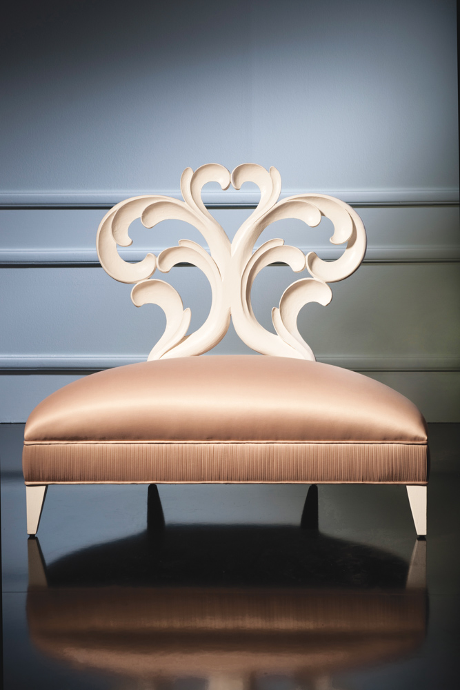 The featherlike designs of the Panache Lounge Chair exemplify graceful detail and visual movement. The exquisite pleating on the border around the base of the chair is not to be missed.