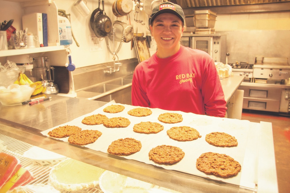 Woman employee baking cookies at Red Bay Grocery