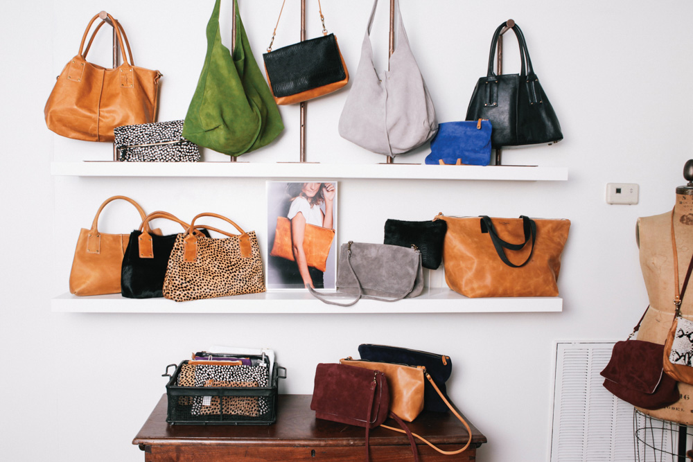 Shelf Display of Ceri Hoover's handbags ranging from color print and styles