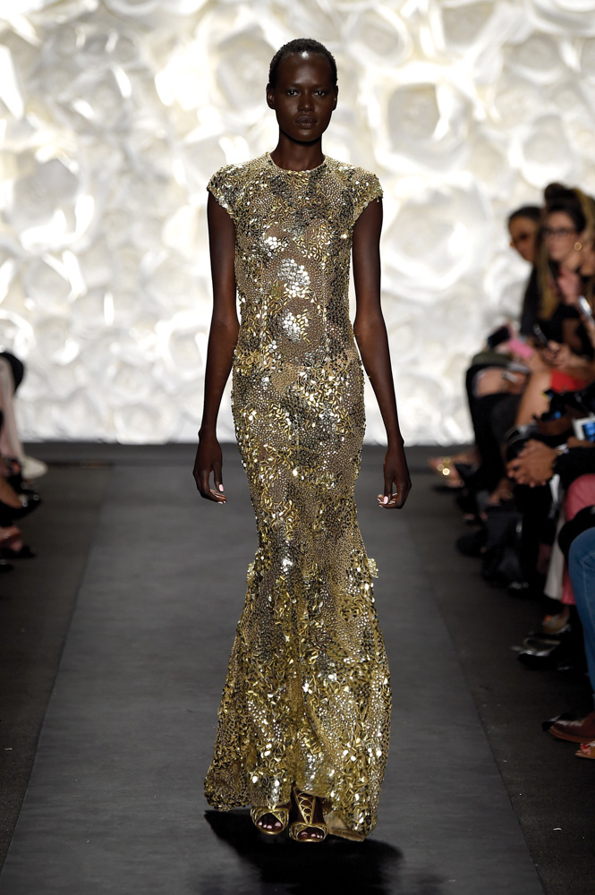 model in gold dress walks runway at Naeem Khan fashion show Mercedes Benz Fashion Week Spring 2015