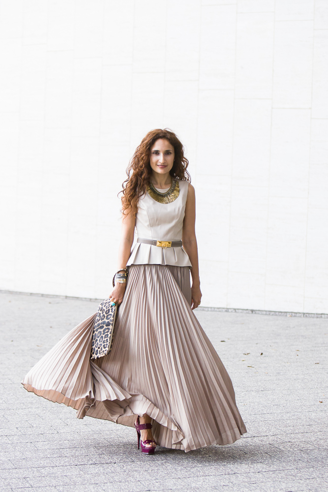 Fashion blogger Sannam Warrender looks romantically chic in knife pleated skirt tank top and waist belt