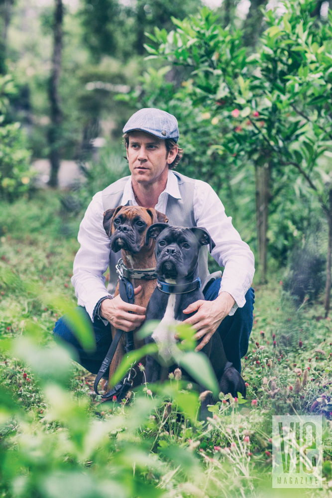 Man with two boxer dogs, styled faux wedding shoot