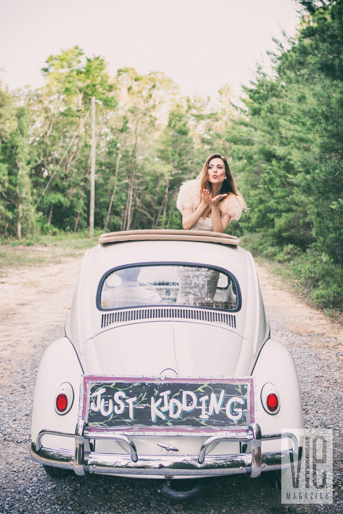 Wedding getaway car with Just Kidding instead of Just Married on rear