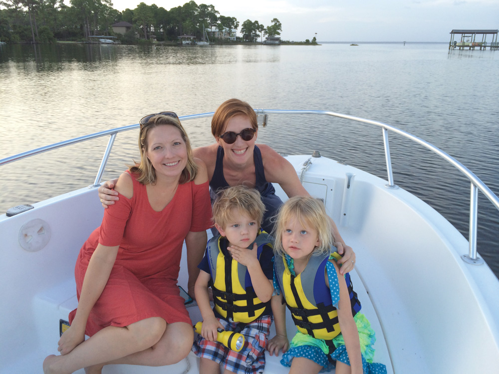 Family on a boat on the choctawhatchee bay 