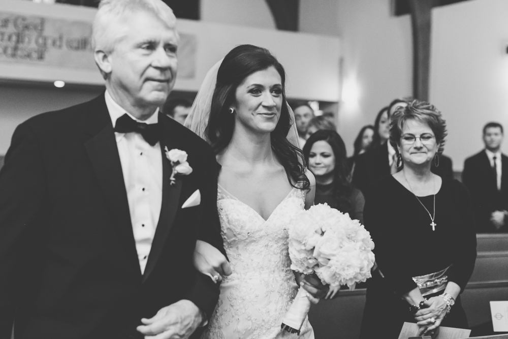 Ainsley and her father walk down the aisle
