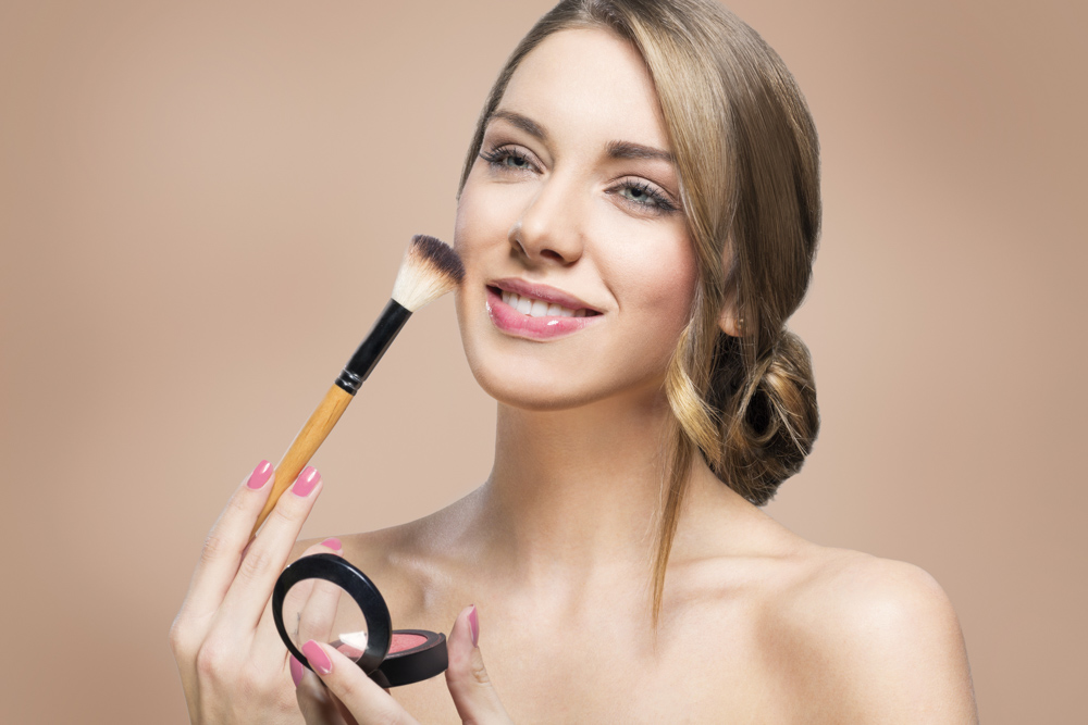 Woman putting makeup on