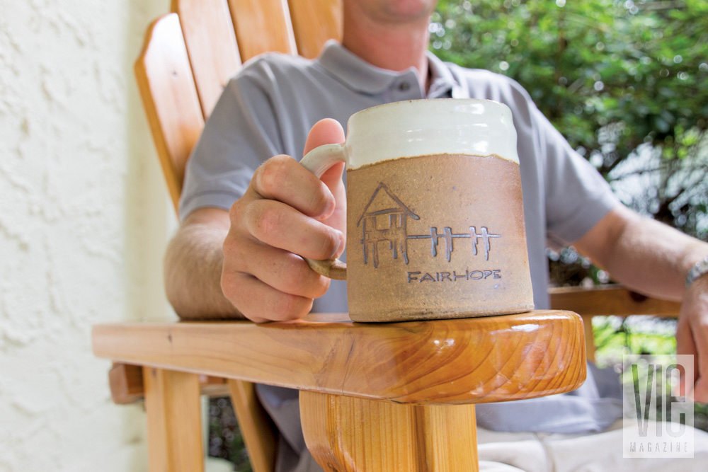 Man holding Fairhope Alabama coffee mug