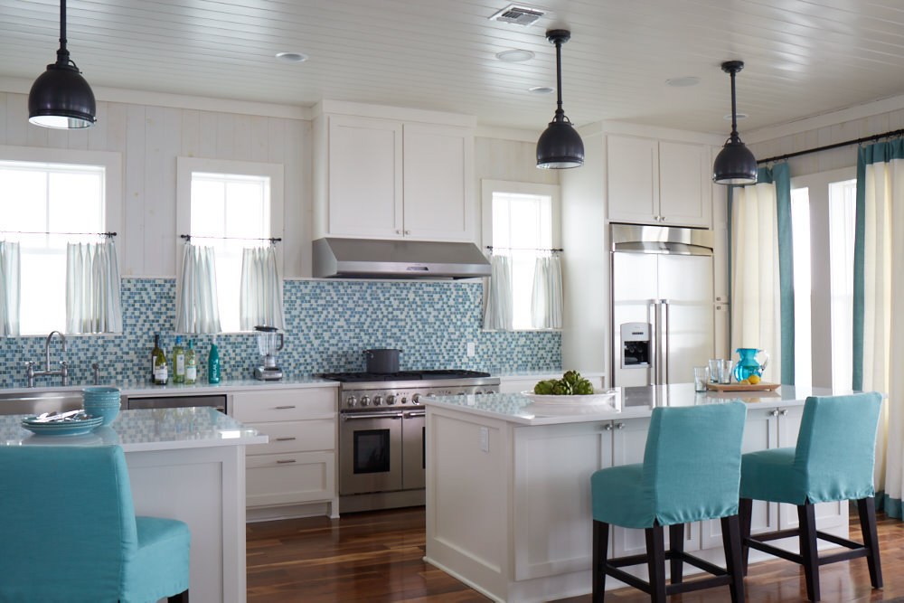 White kitchen with teal chairs