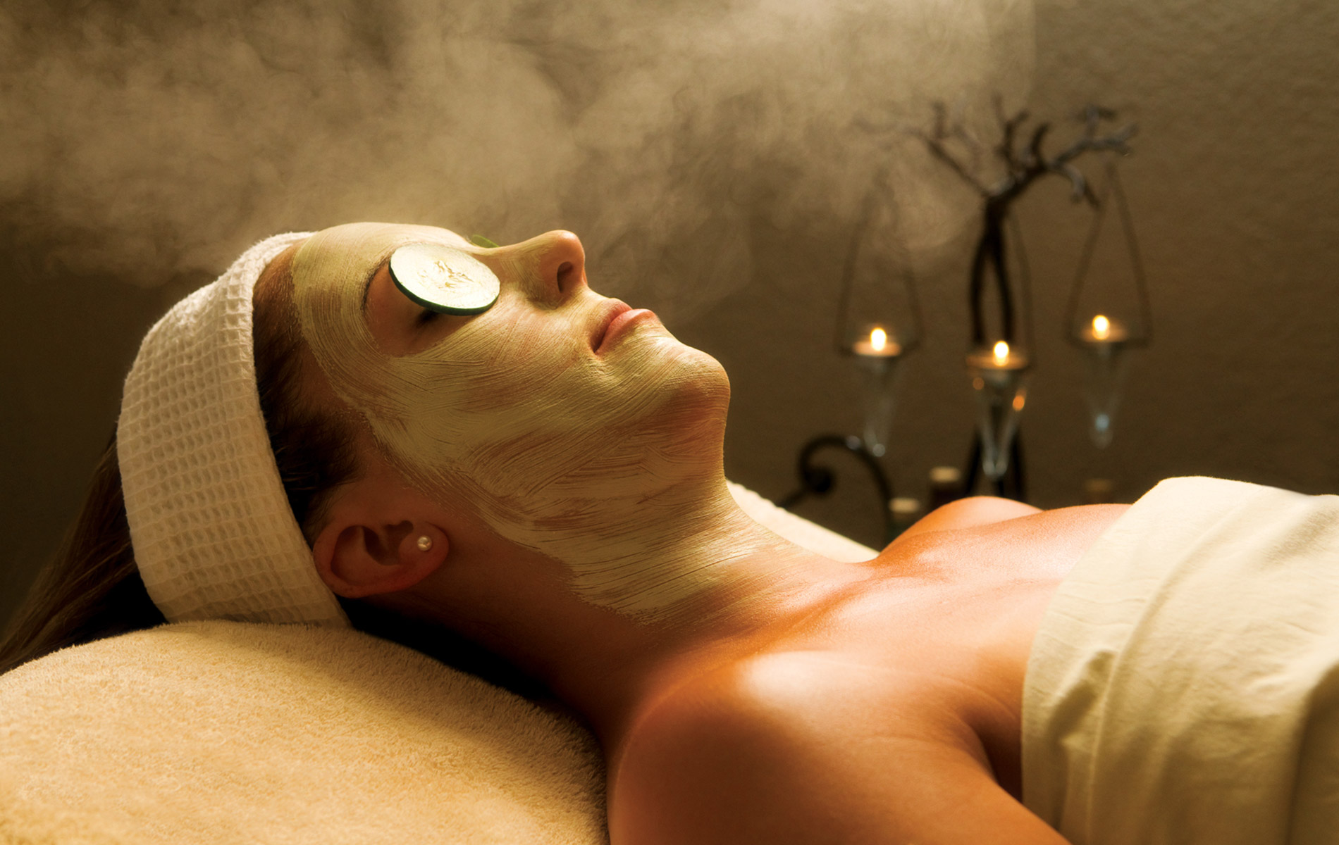Woman relaxing in spa with facemask