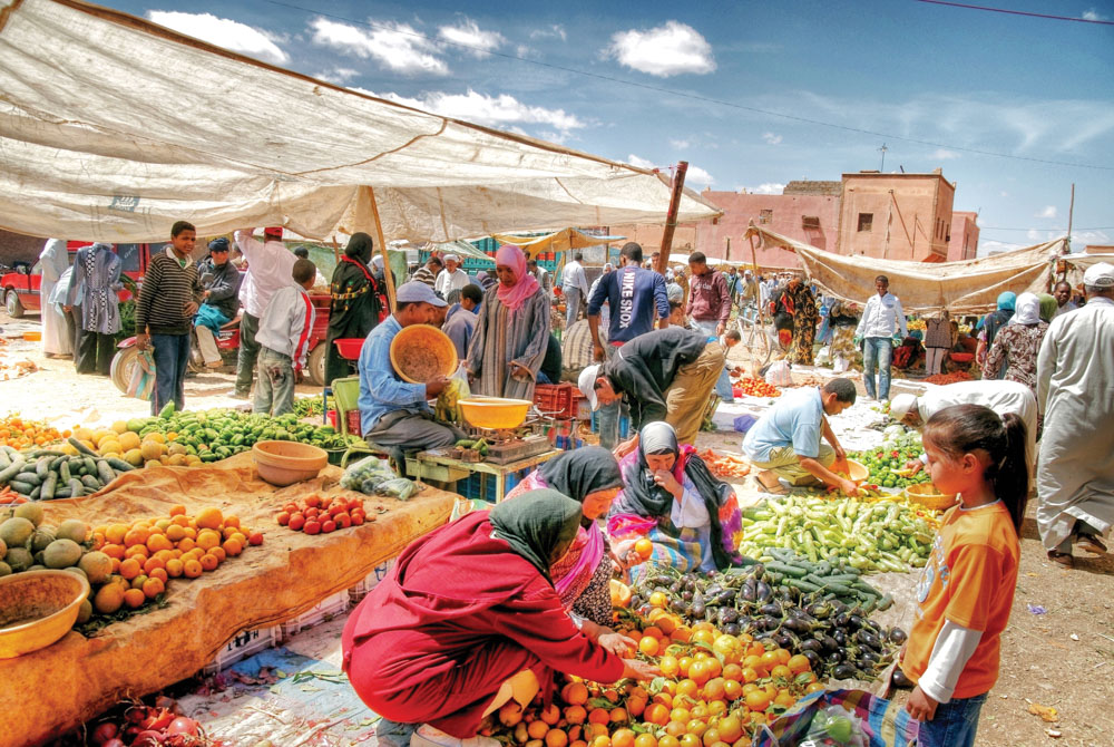 People shopping in an outdoor Moroccan market