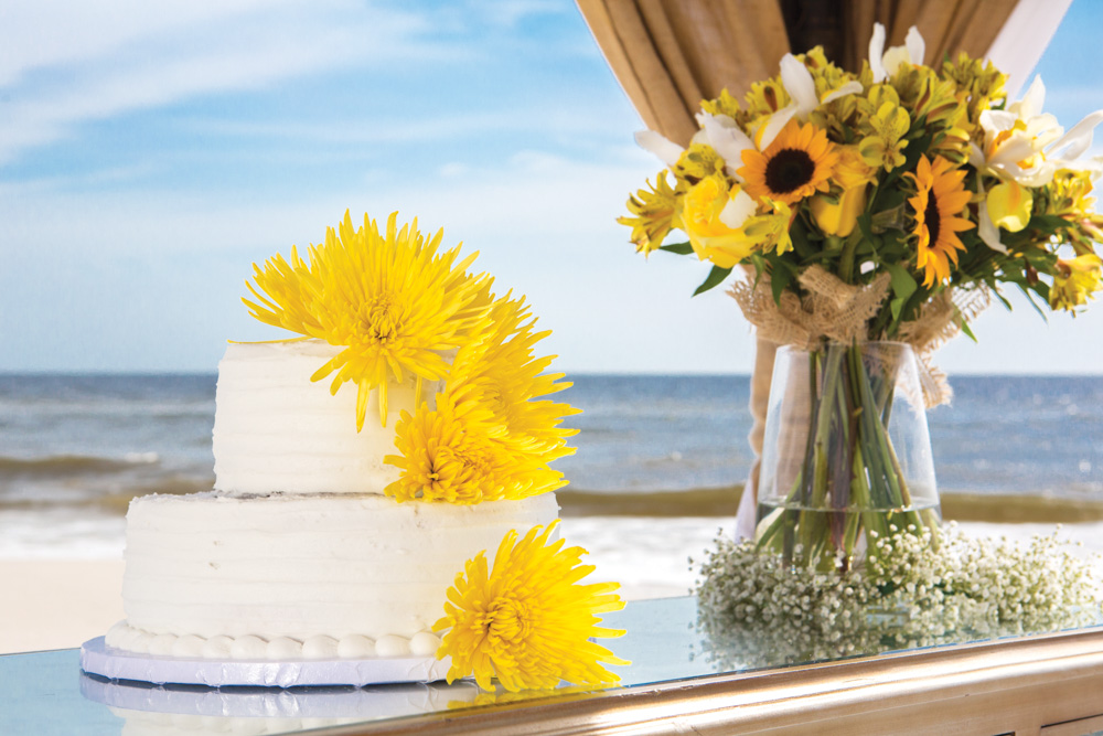 Wedding cake and flowers at Mexico Beach wedding photo shoot, photos by Romona Robbins