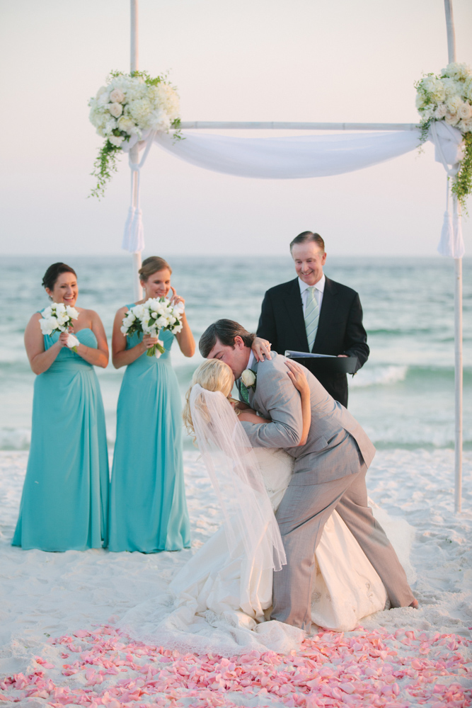 Man kissing bride at Kimberly and Clain Zimmerman beach wedding