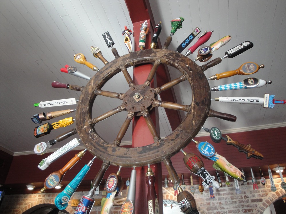 Authentic ship’s wheel with “draft picks” awaiting their next turn