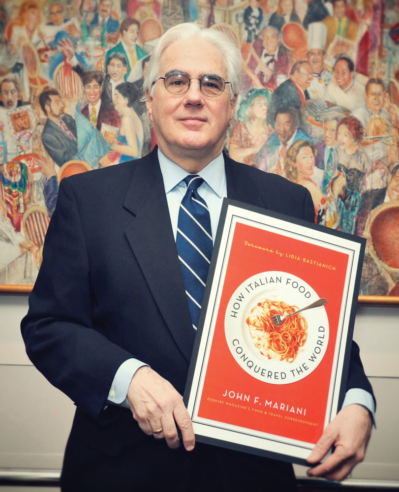 Esquire columnist and acclaimed food writer John Mariani with the cover of his most recent book, How Italian Food Conquered the World Photo Courtesy of John Mariani