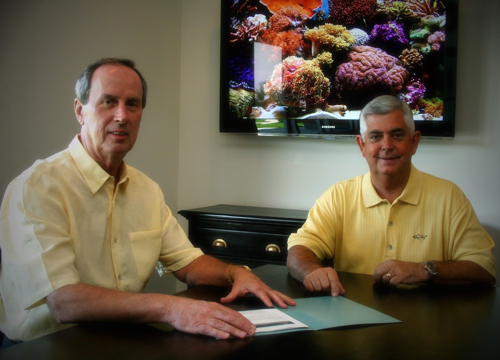 Joe Taylor (Sales Manager) & Tim Taylor (Broker President) vie magazine ocean reef