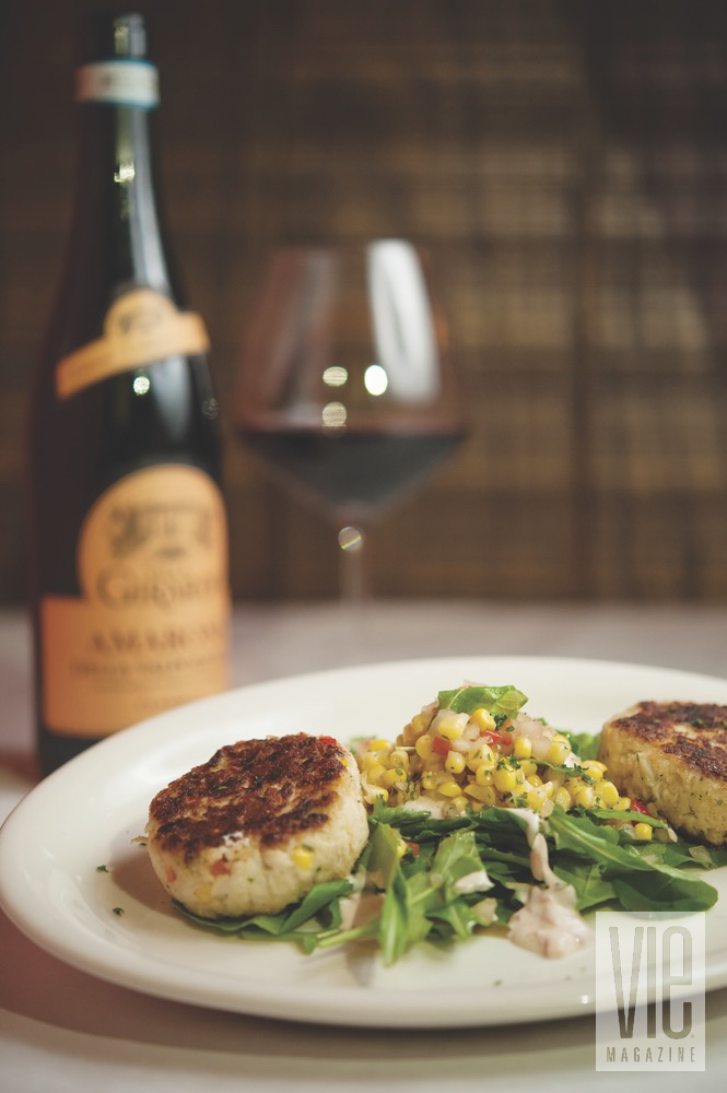 Festive Scallop Dish Served On A Bed Of Greens And Corn Salad