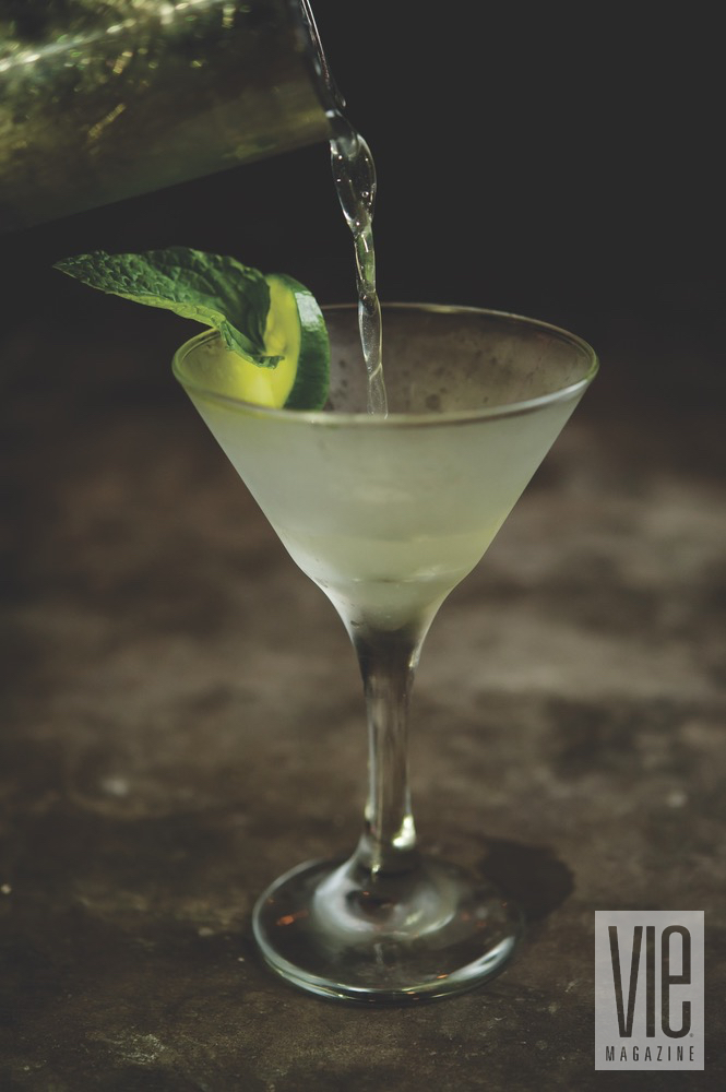 A Chilled Martini With Mint Garnish And A Lime Wedge