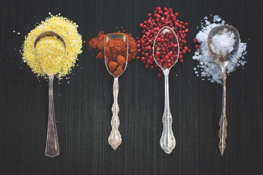 Spoons of Vibrant Colored Spices Are Used To Illustrate the Flavors Used Injected in Cuisine