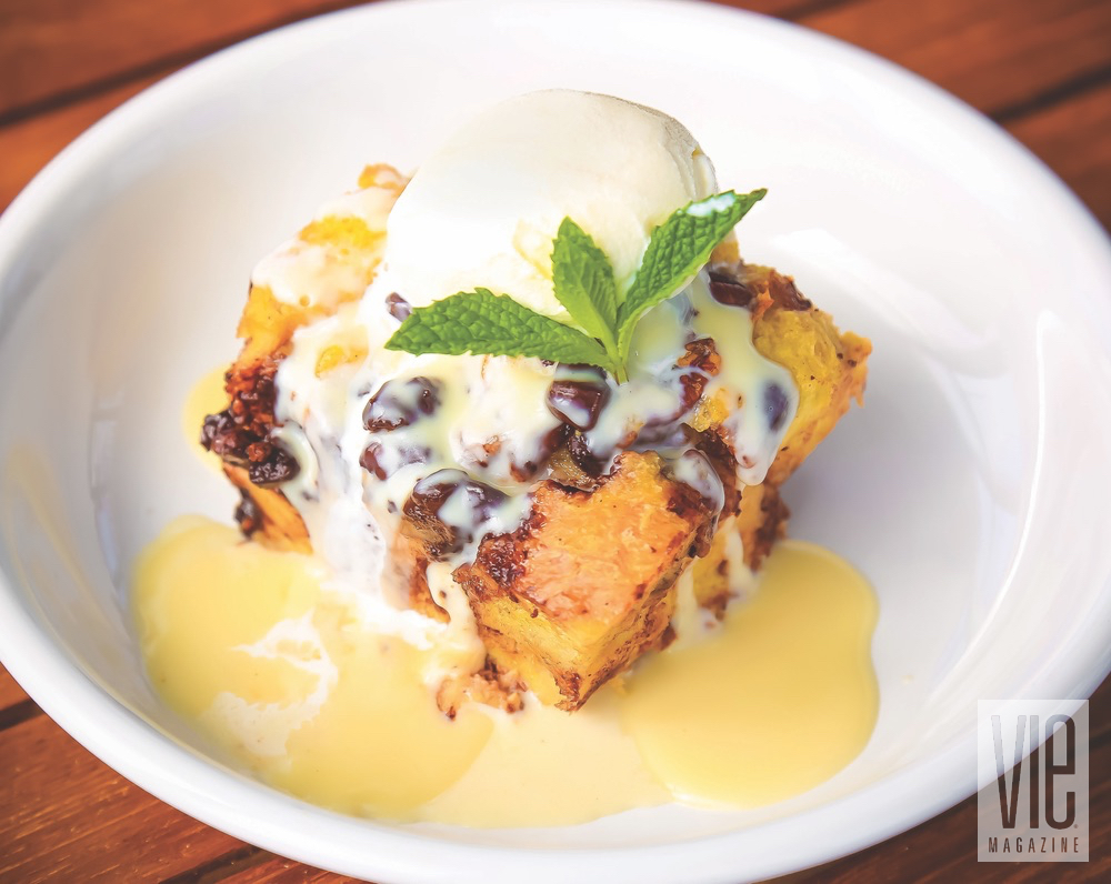 Dark Chocolate Bread Pudding With Whiskey Sauce Garnished With A Mint By Bud And Alleys Restaurant
