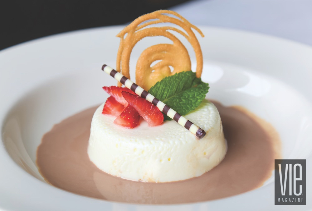 Smooth Vanilla Panna Cotta With Spiced Chocolate Syrup Presented With Strawberries And Chocolate Straw By Cafe Thirty-A
