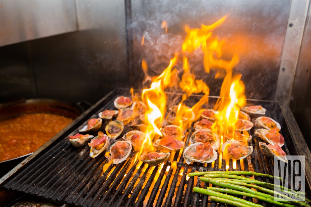 Flams Comming From A Barbecue Of Fire With Oysters And Asparagus