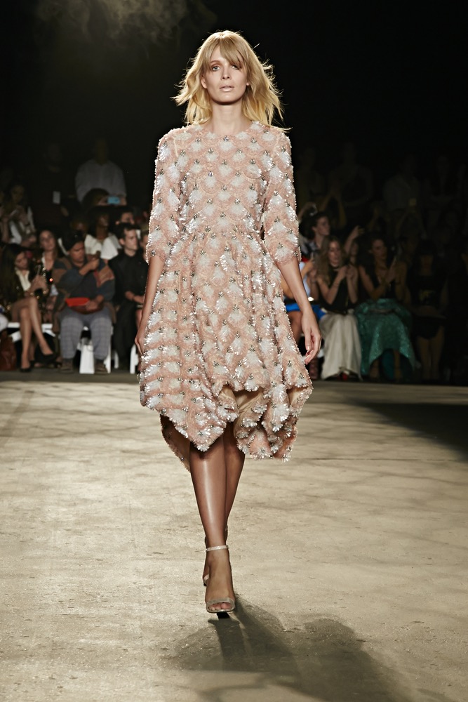 New York Fashion Week Model In A Mid Length Dress Fully Beaded With Colors Of Blush Nude And Gold